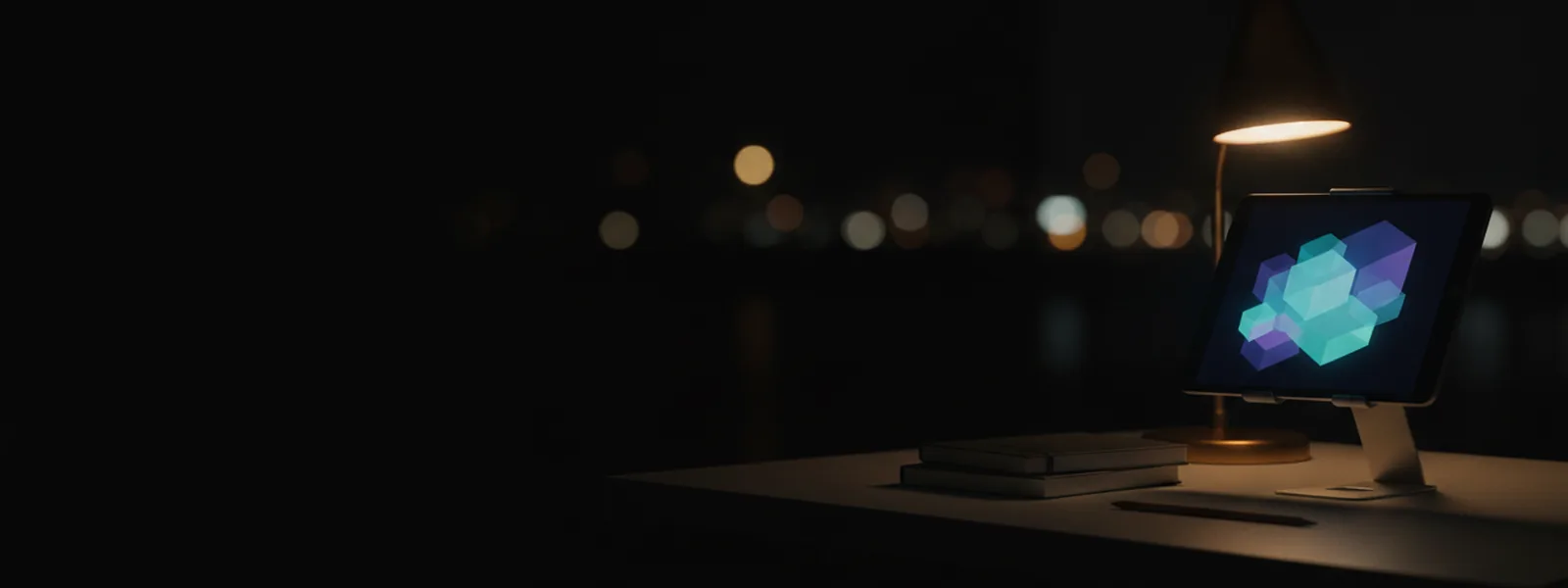 A study desk at night with a tablet on a stand showing soft glowing blocks, a stack of closed notebooks and a pencil beside it.