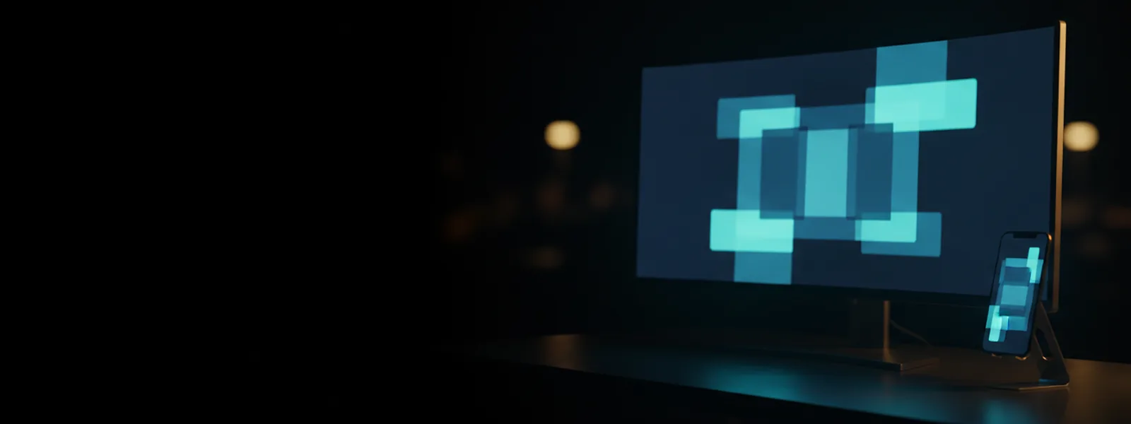A monitor and a phone on a dark desk showing the same glowing arrangement of page blocks.