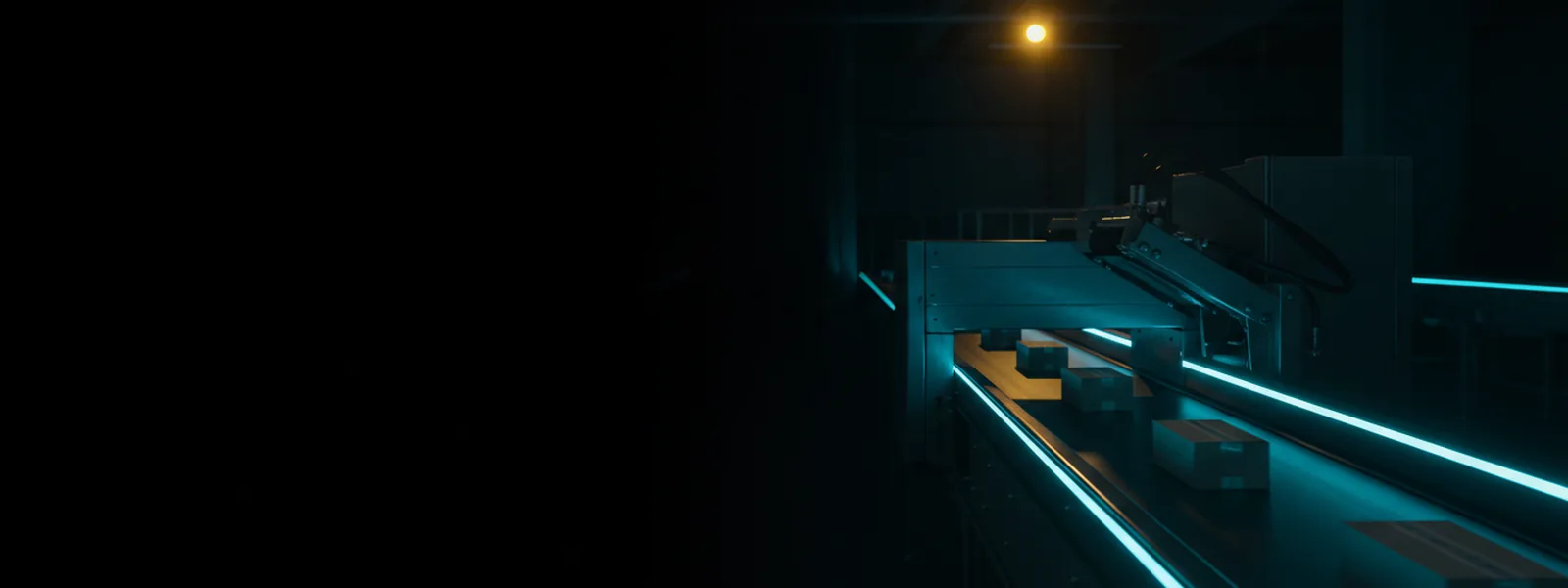 A sorting conveyor running through a dark hall, identical parcels blurred by motion under a diverter arm.